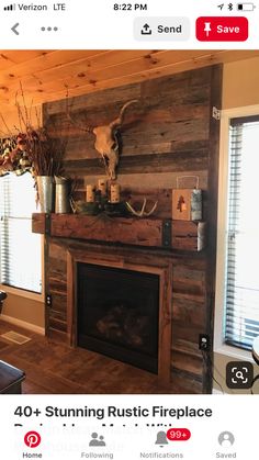 a living room filled with furniture and a fire place covered in deer head mounted on the wall