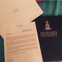 a letter to howard university is laying on the bed