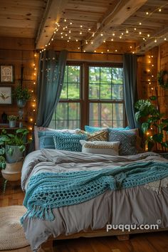 a bed in a room with lights on the ceiling and curtains hanging from the windows