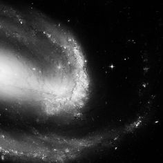 an image of a spiral galaxy in black and white