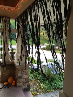 the porch is decorated with halloween decorations