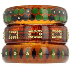 A Mark Davis Collector piece, this bangle is made of vintage marbled tortoiseshell bakelite. Precisely inlaid with "micro" polka dots of vintage blue and green bakelite, this bangle is a technical achievement. A rectangular pattern of bezel-set peridot is overlaid on the inlaid area and encircles the bangle. All stones are individually mounted in 18k yellow gold. Because of its muted colors, this bangle is extremely versatile and will work well in the formation of many stacks. This is a very spe Bakelite Jewelry, Bakelite Bangles, Honeycomb Design, Vintage Bakelite, Ring Pendant Necklace, Muted Colors, Tortoise Shell, Blue And Green, White Diamond