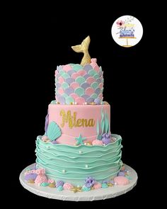 there is a cake with a mermaid theme on it