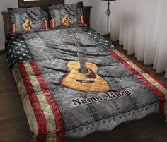 a bed with an american flag quilt and guitar on it, along with the words name hero