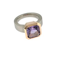 This ring has a custom radiant cut, 10 mm x 10 mm lavender amethyst, approximately 3.75 cts., set in a 14K rose gold bezel. The contrasting shank is solid palladium and measures 5.75 mm wide at the top by 3.5 mm thick and tapers down to 3 mm wide at the bottom by 2.25 mm thick. It is available as a standard in sizes 5.5-8.5 in full, half and quarter sizes and available in other sizes as a special order. It is also available in green amethyst, rock crystal, and blue topaz and in a variety of othe Designer Rings For Women, Lavender Amethyst, Designer Rings, Bezel Set Ring, Radiant Cut, Green Amethyst, Rock Crystal, Amethyst Ring, Modern Jewelry