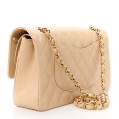 This is an authentic CHANEL Caviar Quilted Medium Double Flap in Beige. This stylish shoulder bag is crafted of quilted caviar leather in beige. The bag features a threaded gold chainlink shoulder strap and and gold Chanel CC turn lock closure. This opens to an inner flap and a smooth leather interior with pockets. Gold Chanel, Stylish Shoulder Bag, Chanel Caviar, Leather Interior, Smooth Leather, Chain Link, Shoulder Strap, Chanel, Shoulder Bag