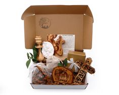 Introducing our Exquisite Christmas Holiday Gift Basket - A Thoughtful Blend of Personalized Gifts, Religious Inspiration, and Cozy ComfortCelebrate the holiday season with a gift that radiates love, faith, and the spirit of Christmas. Our meticulously curated Christmas Holiday Gift Basket is a testament to the true essence of this special time of year. Handcrafted in the Holy Land, each item within this personalized gift box is imbued with history, devotion, and a touch of hygge to bring joy to Holiday Gift Basket, The Spirit Of Christmas, Holiday Gift Baskets, Comfort Gifts, Spirit Of Christmas, Wood Candle Sticks, Christmas Gift Basket, Catholic Gifts, Holiday Christmas Gifts