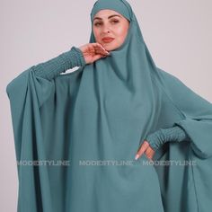 Elevate Your Modest Fashion With Our Exotic Turquoise 3-Piece Jilbab Set. This Exquisite Ensemble Is Designed For The Modern Woman Who Values Both Style And Modesty. The Set Features A Stunning Exotic Turquoise Shade, Radiating Elegance And Sophistication. Skirt: Flowing And Comfortable, Ensuring Ease Of Movement And Modesty. Matching Khimar: Long And Graceful, Providing Full Coverage And A Sense Of Sophistication. Matching Niqab: Enhances Privacy And Completes The Chic Ensemble. Chunky Elastic Blue Long Khimar For Eid, Long Blue Khimar For Eid, Modest Long Sleeve Blue Kaftan, Modest Blue Niqab For Eid, Traditional Solid Color Khimar For Eid, Traditional Solid Khimar For Eid, Blue Long Sleeve Thobe For Eid, Blue Long Sleeve Thobe With Dabka Details, Blue Long Sleeve Thobe With Dabka