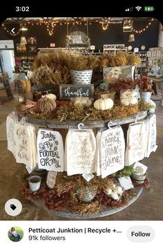 a display in a store filled with lots of signs and pumpkins on the table