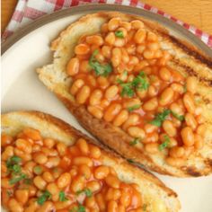 two pieces of bread with baked beans on them