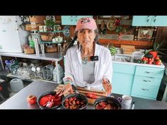 the woman is making some food in her kitchen