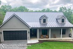 a house with a metal roof and two car garages