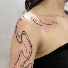 a woman with a tattoo on her arm