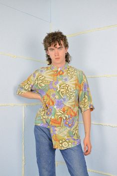 Vintage multicolour graphic hawaiian short sleeve shirt {K175} PRODUCT INFO: Material - 100% VISCOSE / Size tag on item - L / PIT TO PIT - 61 CM / 24 INCH / FULL LENGTH - 92 CM / 36 INCH / Our model is 186 cm and normally wears a size M/L INFO: Due to item's vintage condition, the original tag might not show the true size. If you have any questions about this product or shipping just drop us a message and we will get back to you as soon as possible. CONDITION: Please note that Hanger Vintage sel Hawaiian Shorts, Festival Shirts, Trouser Suits, Style Expert, 1980s Vintage, Buy Vintage, True Vintage, Shirt Price, Size Tag