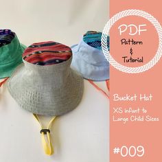 three bucket hats with different colors and patterns on them, one has a banana attached to it