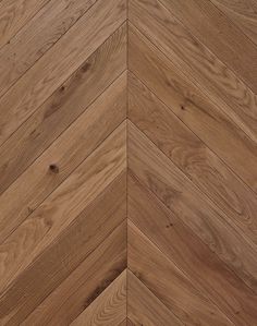 an image of wood flooring that looks like herringbones or chevron boards