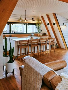 a kitchen and living room in an attic