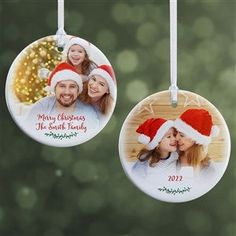 three personalized christmas ornaments hanging from strings