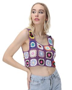 a woman with blonde hair wearing a purple crochet crop top and blue jeans