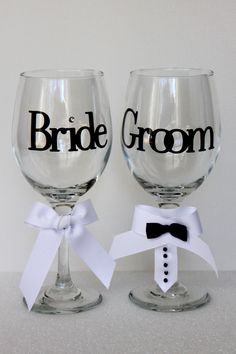 two wine glasses with the words bride and groom on them