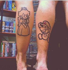 two people with tattoos on their legs, one has a princess and the other has a mario