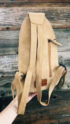 Calling all boot stitch fans....this backpack has got it all for you! SO many gorgeous details in one backpack. Made from a soft suede leather, front leather patch with buckstitch, and embroidered detail. Main pocket has zipper closure, fully lined, inner zipper privacy pocket, front panel pocket with leather patch, and zipper closure. Back zipper privacy pocket/concealed weapons carrier.Backpack style straps that are adjustable. Concealed Weapons Carrier Hand Picked | Premium Quality | Genuine Everyday Leather Backpack For Fall, Leather Backpack With Adjustable Strap For Fall, Casual Brown Leather Backpack With Leather Patch, Outdoor Leather Backpack With Zipper Closure, Outdoor Leather Satchel Backpack With Zipper, Casual Leather Backpack With Leather Patch, Casual Leather Bag With Leather Patch, Beige Leather Backpack With Zipper, Casual Everyday Leather Backpack With Leather Patch