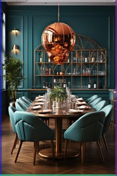 a dining room table with blue chairs and a gold chandelier