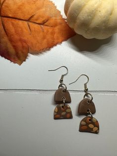 Dainty hand made polymer clay fall earrings. Hypoallergenic and light weight! Comfortable and stylish to wear! Artsy Brown Drop Earrings, Brown Dangle Earrings With Artsy Style, Artsy Brown Earrings With Ear Wire, Brown Polymer Clay Drop Earrings, Trendy Hypoallergenic Earrings, Trendy Hypoallergenic Brown Earrings, Trendy Brown Hypoallergenic Earrings, Clay Fall Earrings, Polymer Clay Fall