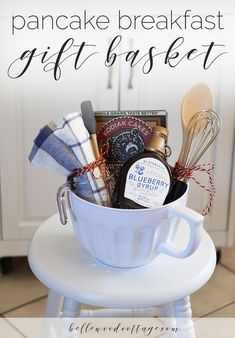 a gift basket sitting on top of a white stool