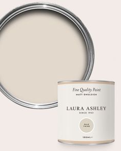 a white paint can with the words,'fine quality paint'in front of it