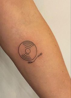 a record player tattoo on the arm