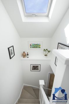 the skylight is above the stairs leading up to the second floor