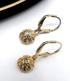 "Brand new marked 925 gold plated sterling silver & CZ drop earrings, In very good condition. It's 1\" long. Cz 9 mm across. Weighs 2.7 gram. Thanks." Classic Gold Diamond Drop Earrings, Gold Hallmarked Diamond Earrings, Classic Gold Diamond Earrings Hallmarked, Classic Gold Hallmarked Diamond Earrings, Formal Filigree Diamond Drop Earrings, Formal Filigree Drop Diamond Earrings, Gold Hallmarked Diamond Earrings For Anniversary, Gold Sterling Silver Diamond Earrings With Accents, Diamond Filigree Earrings In Yellow Gold