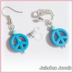 Blue Peace Sign Dangle Earrings  1 Pair Plastic Clip-on Earpiece or choose metal clips or fish hook type for pierced ears.  Approx. Size: 1  inch long (drop size).  Get the look of pieced without having your ears pierced. They are so lightweight you will forget you are wearing earrings.  See the picture(s) for more details. Not recommended for very young children due to choking hazards.  Handmade to Order  Handle with care, do not pull the earpiece too far apart when putting them on. To tighten see the photo/photo card included with the purchase. The additional shipping charge, when combined with another item, is 25 cents (Combined Payment Only) Visit my Etsy Shop: https://www.etsy.com/shop/JuiceboxJewels I do not take returns/exchanges on earrings for hygienic reasons. Blue Metal Clip-on Jewelry, Blue Clip-on Drop Earrings, Blue Round Clip-on Jewelry, Blue Clip-on Earrings As Gift, Blue Metal Clip-on Earrings, Adjustable Clip-on Drop Earrings Jewelry, Adjustable Clip-on Drop Earrings, Summer Blue Metal Hoop Earrings, Adjustable Clip-on Hoop Earrings As A Gift