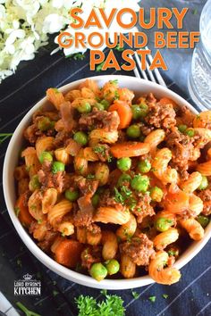 Savoury Ground Beef Pasta is a wonderful fall-inspired dish which is prepared in less than 45 minutes. With ingredients like beef, carrots, onions, tomatoes, peas, and thyme, who could resist? This is not your average ground beef pasta; this is hearty, comforting, and perfect for the cooler months ahead. #groundbeef #pasta #beef #family