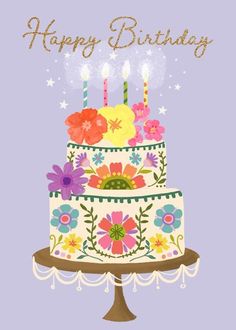 a birthday cake with candles and flowers on it's top is in front of a purple background