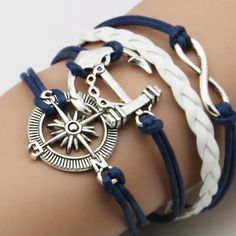 Not All Who Wonder Are Lost This Beautiful Nautical Bracelet Is Sure To Please Any Age Group. She Is Adjustable With Silver And Has Blue And White Cording Going Up To The Compass The Anchor And The Infinity With Silver Color Accents. This Will Make Anyone Think Of The Water!! Nib I Will Bundle And Open To All Reasonable Offers Considered Thank You Happy Shopping Yall!! Cat Charm Bracelet, Baseball Bracelet, Nautical Bracelet, Wood Bead Bracelet, The Compass, Open Cuff Bracelet, Color Accents, Clay Bracelet, Nautical Jewelry