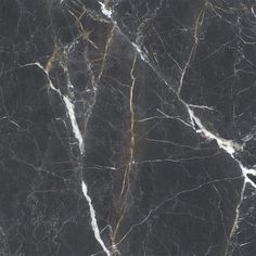 black marble textured with gold veining and white streaks on the top right side