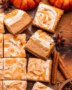 several slices of pumpkin spice cake on a cutting board with cinnamon sticks and star anise