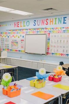 an empty classroom with desks and colorful decorations