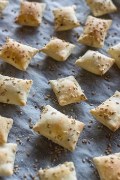 some food is laying out on a baking sheet and sprinkled with seasoning