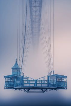 an image of a blue bridge in the fog