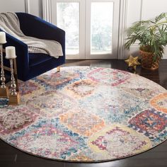 a living room area with a blue chair and rug