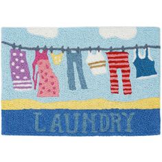 a blue door mat with laundry hanging on clothesline and the words laundry written below it