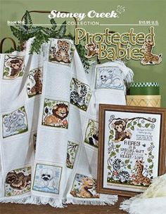 an animal themed blanket and two framed pictures