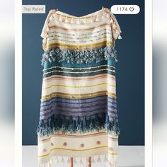 a dress with tassels and fringe on the shoulders is displayed in an instagram