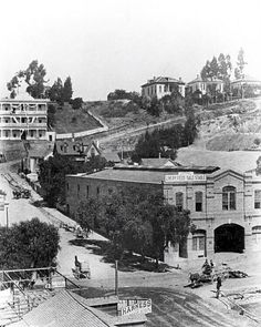 an old black and white photo of a town