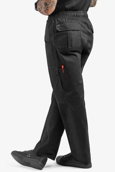 A roomy fit and 7 pockets make our Men's Chef Utility Pants a perfect combination of ease and function. There’s a place for everything – including a loop for a towel and a special pocket for your cellphone. UA CHEF™ pants let you cook up your own style in comfortable, durable cotton fabric. • Relaxed fit • Elastic waist with inner drawstring • Zip fly • Baggy leg • Total of 7 pockets • 2 front patch pockets • 2 back pleated, flapped pockets • 2 cargo pockets • Left cargo pocket has secure closur Full-length Work Pants With Pockets For Outdoor, Functional Cargo Pants With Multiple Pockets For Work, Tapered Leg Cargo Pants With Pockets For Outdoor Work, Functional Straight Leg Work Pants With Pockets, Functional Workwear Bottoms With Cargo Pockets, Functional Cargo Pocket Workwear Bottoms, Black Work Pants With Pockets For Outdoor, Black Work Pants With Pockets For Outdoor Work, Black Work Bottoms With Multiple Pockets For Outdoor