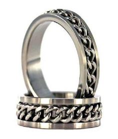 Polished titanium is the ideal metal for this unique men's spinner ring. Perfect for the rugged individualist, a men's titanium ring with a spinning chain can be worn as a fashion ring or a wedding band. Men love the textural effect of this lightweight 8mm band. Biker Rings Mens, Titanium Rings For Men, Unique Mens Rings, October 5th, Mens Rings Fashion, Biker Rings, Titanium Ring, Titanium Jewelry, Gold Chains For Men