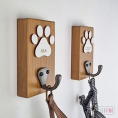 two animal themed hooks hang on the wall